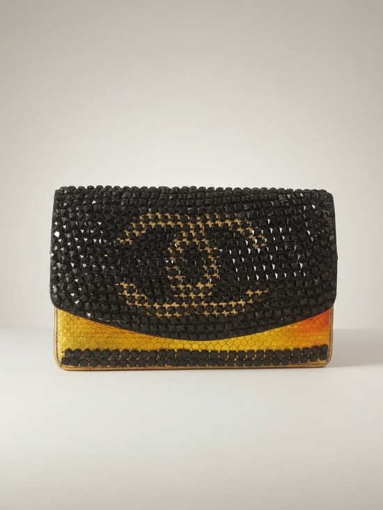 CHANEL Handbags - CHANEL Black and Yellow Studded Flap Clutch